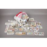 A bag containing a large selection of used and first day of issue stamps, comprising of The