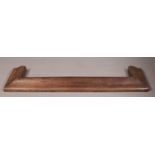 An Arts & Crafts oak curb fender after Charles Voysey, of ogee form and with raised peg moulding