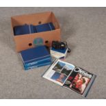 A Olympus AZ-210 Super Zoom camera to include You and your camera volumes 1-8 books