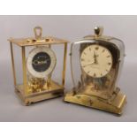 Two anniversary clocks, to include New Master and a Schatz electronic example.