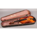 A wooden cased full size Chinese violin, label for Parrot, with bow.