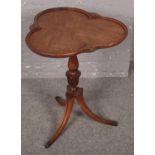 A carved mahogany tripod occasional table with trefoil dish top. (66cm x 55cm) Minor scratches to