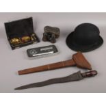 A group lot of collectables to include Bowler hat, sword in wooden sheath, boxed set of compass,