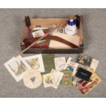 A box of collectables, to include boomerang, walking stick, empty Wade commemorative decanter,