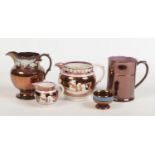 A collection of 19th century copper lustre pottery. Two Sunderland pink lustre jugs sprigged with