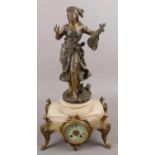 An eight day spelter figural table clock raised on a carved onyx base with ormolu mounts. (54cm
