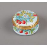 A Moorcroft enamel circular trinket box decorated with strawberries, 3.5cm diameter with original