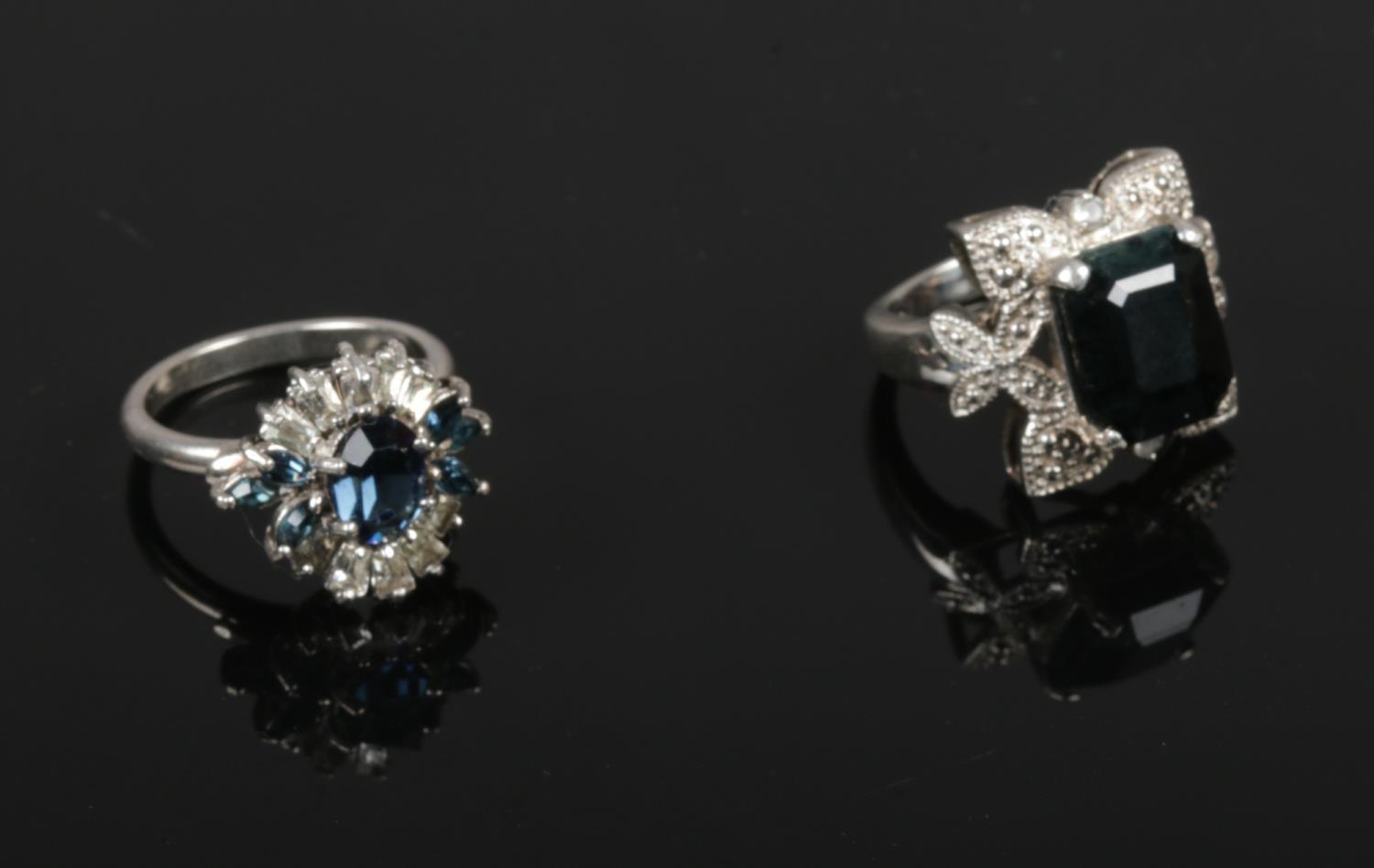 A silver Black Onyx & marcasite ring, size M, to include a silver blue stone cluster ring, size N