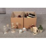 Two boxes of miscellaneous, silver plated candelabra, Jameson whiskey advertising jug, The Bisto