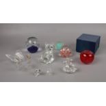 A group of glassware, paperweights, animal figures swan, cat, seal examples