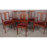 A set of 6 Edwardian spindle back dining chairs to include 2 carvers. One carver leg has snapped,