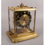 A Schatz brass and perspex anniversary clock, with Westminster, St Michael and Whittington chime. No