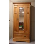 A carved satinwood mirror front wardrobe. (219cm x 96cm)