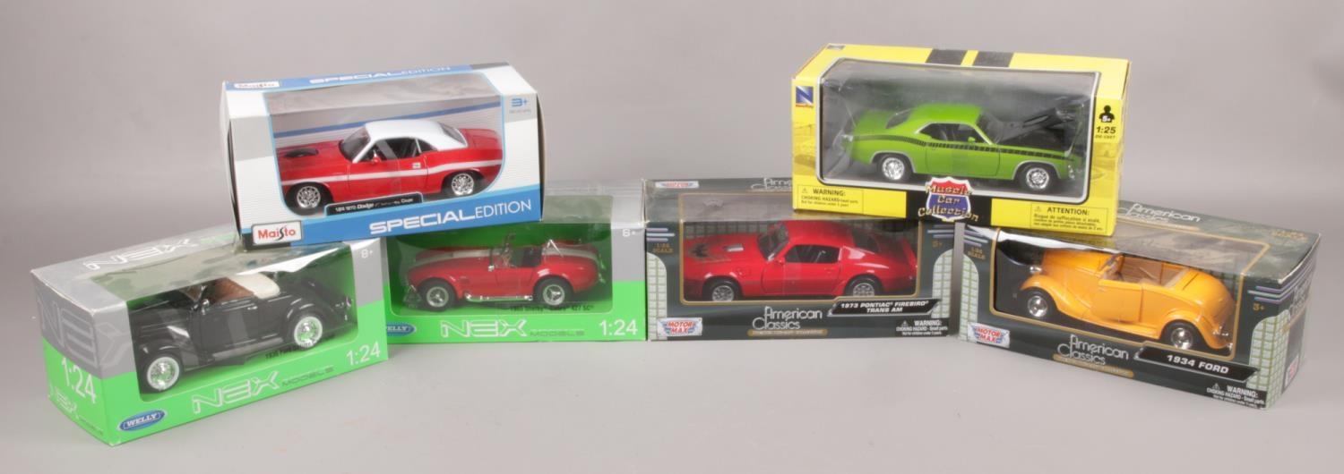 Six boxed diecast model cars, 1:24 scale, to include Maista, Motor Max, Welly Nex and New Ray.