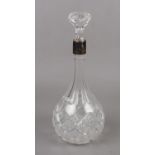 A crystal decanter with silver collar (indistinct hallmarks ) with stopper ( 33cm height)