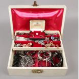 A jewellery boxes with contents of costume jewellery to include necklaces, earrings, bracelets, etc.