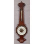 A carved oak banjo barometer.