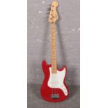 A Squier Fender Affinity series Bronco Bass electric guitar, in red and white colourway, serial