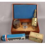 A wooden box of collectables to include Ronson lighter, boxed diecast, metal Britannia Dairy