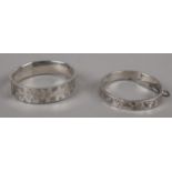 Two silver bangles, one with faded hallmarks, assayed Birmingham, 38g.