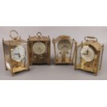 Four small brass anniversary torsion clocks, to include Schatz and Koma examples.