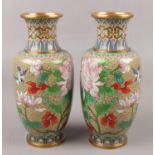 A pair of Chinese cloisonne vases, decorated with birds and flowers, height 21cm. Good condition.