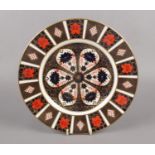 A Royal Crown Derby porcelain plate decorated with Imari colours, 27cm diameter.