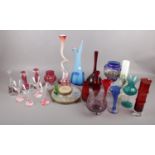 Two boxes of assorted coloured glassware to include, a Aseda Glasbruck Bamboo shaped glass vase by
