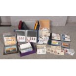 A large collection of stamps and first day covers, some with associated commemorative coins