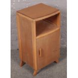 A light oak bedside cabinet. (70cm x 37cm)