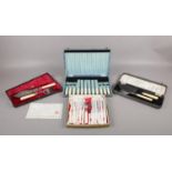 A selection of four boxed fish cutlery sets comprising of, a boxed set of serving fish knife and