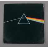 A Pink Floyd Dark Side of The Moon LP, SHVL804 Stereo, with solid blue triangle, includes posters
