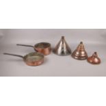 A collection of copperware comprising of, three copper washing dollies. One dolly is made by The
