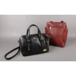 A Gigi brown leather Handbag to include a pure luxuries London black Leather handbag ( with dust