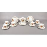 An Art Deco ceramic tea set, teapot, 6 cups & saucers. 6 tea plates.