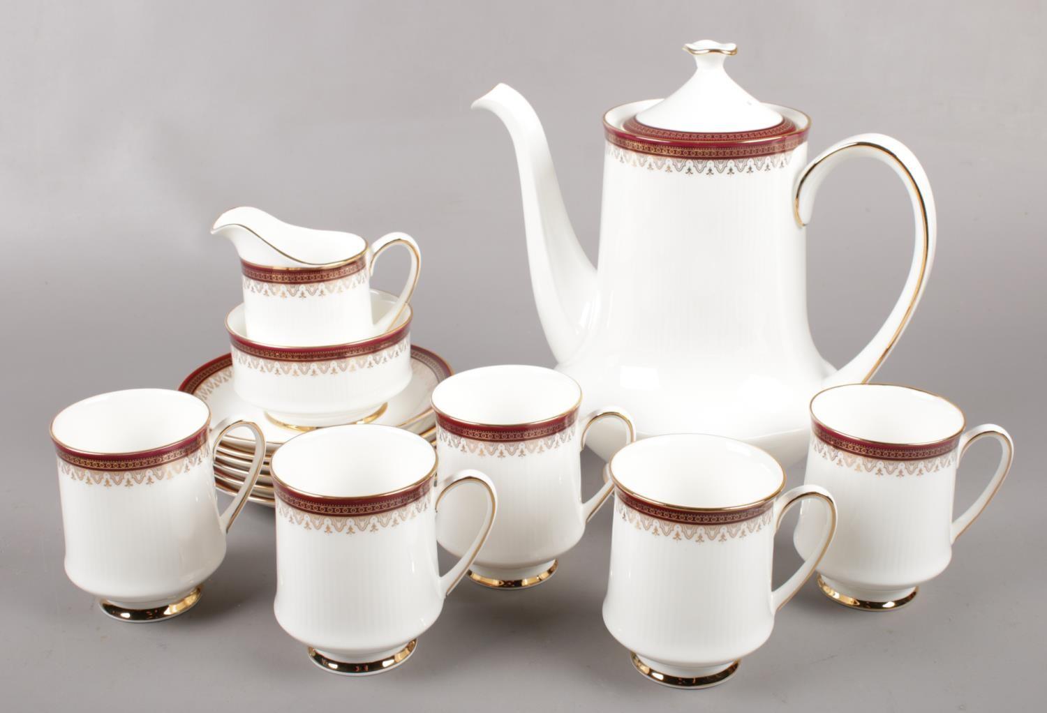 A part Paragon Holyrood bone china teaset, to include teapot, cups, saucers, sugar bowl and cream