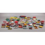 A box of die cast vehicles, Dinky, Corgi, Matchbox examples.