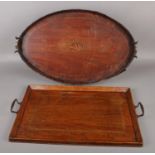 A Victorian mahogany twin handled serving tray with inlaid shell patera motif, along with a