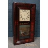 A Chauncey Jerome (American) wooden mounted wall clock with glass fronted door. There is a scene