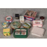 A box of vintage tins to include Twinings tea, commemorative examples etc.