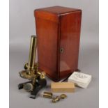 A mahogany cased brass monocular microscope by R Field & Son, Birmingham.