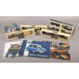 A collection of boxed Lledo Days Gone diecast model vehicles, along with three modern metal