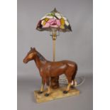 A retro chalk table lamp in the form of a horse together with a Tiffany style lamp shade. Total