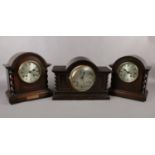 Three wooden mantel clocks comprising of two 'Astral 'oak mantel clocks, one of which was