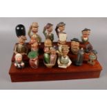 A collection of Anri Mechanical Vintage Italian wooden bottle stoppers, Man putting on glasses,