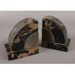 A pair of Art Deco marble bookends. Chips to both.