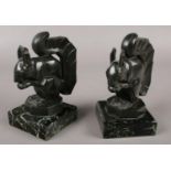 Max Le Verrier (French 1891-1973) a pair of art deco verdigris bronze figures. Each formed at a