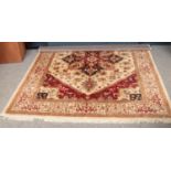 A cream ground wool rug with central medallion design (280cm length 199cm width)