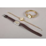 Three ladies wristwatches, to include two manual examples and a quartz.