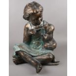 A composite figure group of a seated girl and dog. (47cm tall)